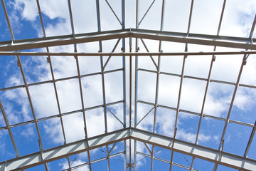 The structure of the steel frame for building construction on sky background. Zinc metal coating to protect against corrosion. 