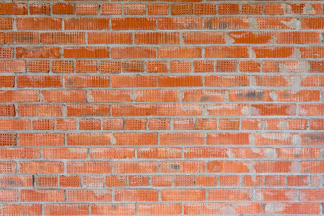 Brickwork in the construction of a new high-rise building. The use of traditional building materials.