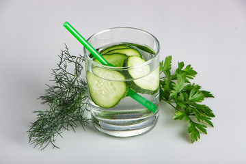 Cucumber water, cleansing water to detoxify the body and quench thirst on a white background.