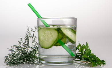 Cucumber water, cleansing water to detoxify the body and quench thirst on a white background.