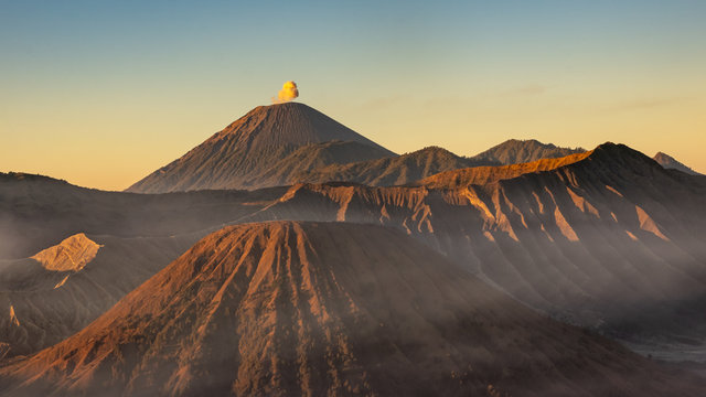 Golden hour photograph in Bromo volcano while Semeru erupts