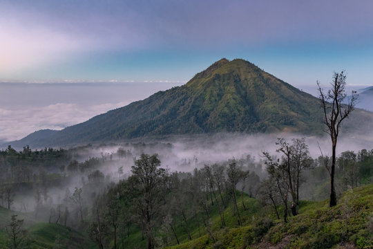 A misty blue sunrise from Ijen volcano