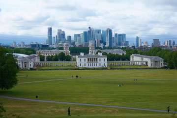 LONDON, ENGLAND/UNITES KINGDOM –– JUNE 11 2019: View of London from Greenwich park at cloudy summer day