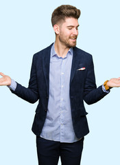 Young handsome bussines man Smiling showing both hands open palms, presenting and advertising comparison and balance