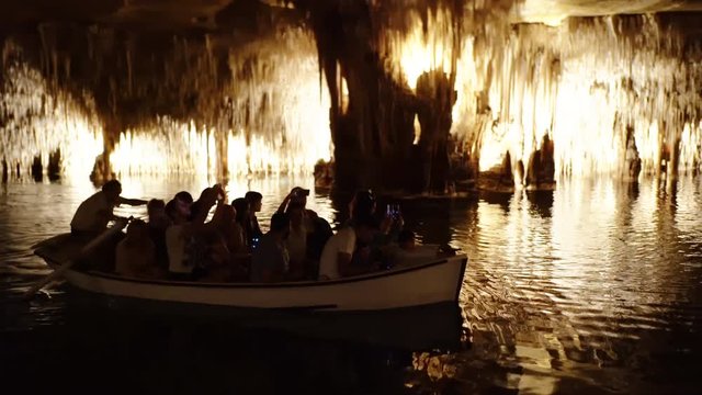 Underground cave boat tour at Cuervas del Drach in Mallorca Spain