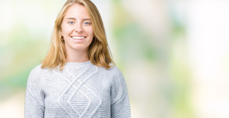 Beautiful young woman wearing winter sweater over isolated background with a happy and cool smile on face. Lucky person.