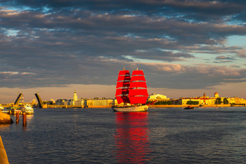Ship with red sails sails on the Neva. Preparation for the holiday of all schoolchildren "Scarlet Sails" in St. Petersburg