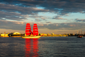 Ship with red sails sails on the Neva. Preparation for the holiday of all schoolchildren "Scarlet Sails" in St. Petersburg