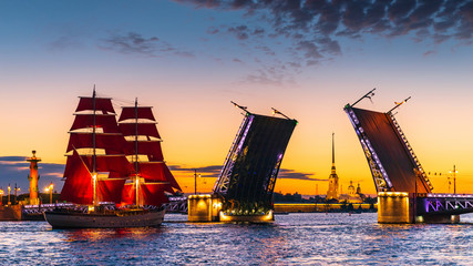 Ship with red sails sails on the Neva. Preparation for the holiday of all schoolchildren "Scarlet Sails" in St. Petersburg