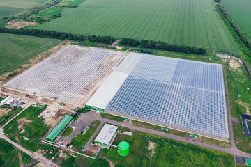 Aerial view of big modern greenhouse for industrial agriculture cultivating and growing plants