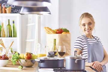 Young Woman Cooking in the kitchen. Healthy Food
