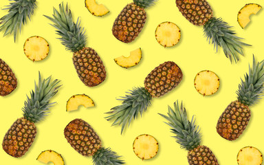 Summer pineapple fruit pattern on a bright yellow background