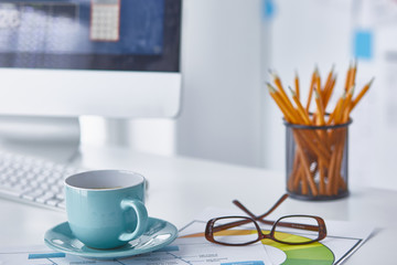 A cup of coffee on the office table