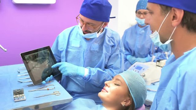 Dental Team Examining Radiography