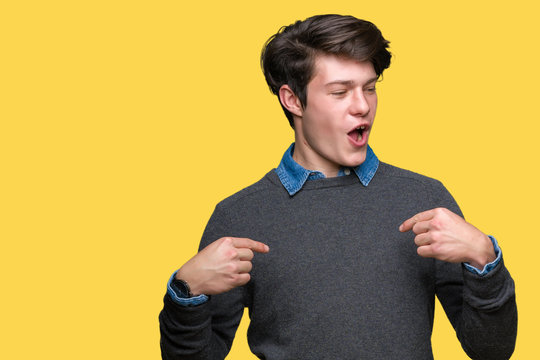 Young handsome elegant man over isolated background looking confident with smile on face, pointing oneself with fingers proud and happy.