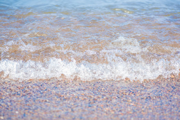Sea water splashing on a rocky beach