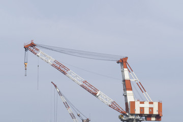 Fototapeta na wymiar big construction cranes of a shipyard
