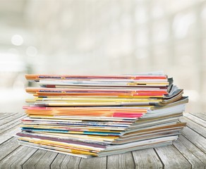 Pile of newspapers on white background