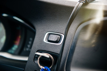 Obraz na płótnie Canvas Close-up on the Start Stop engine button inside modern luxury car