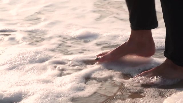 On the wet sand, foot prints, washes away wave, this place is suitable for feet