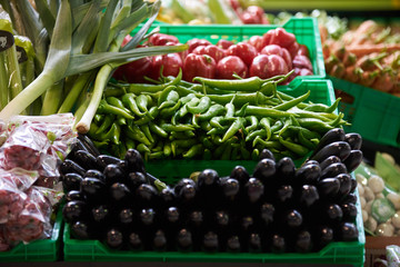 Assortment of fresh fruits and vegetables in wooden box, close-up