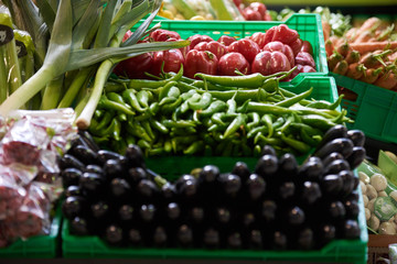 Assortment of fresh fruits and vegetables in wooden box, close-up