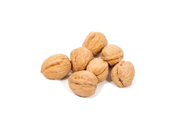 Raw walnuts in shell isolated on white background.