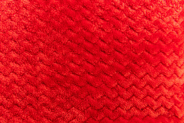 Close up of red cloth fluffy faric in zigzag pattern.
