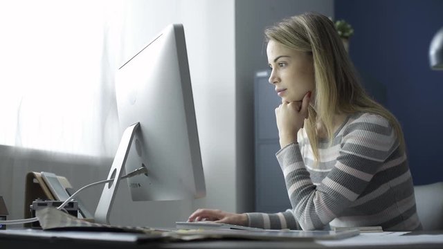 Young woman working with a computer in the office
