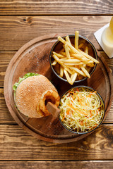 burger with french fries and salad