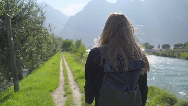 Teenage Girl Walking Along hte River