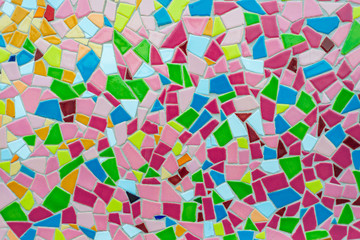 Colorful pastel vivid colour and various geometric shape and size of mosaic tile with random pattern.