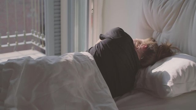 Teenage Girl Sleeping in Bed