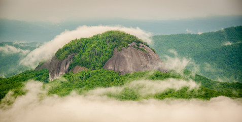Gorgeous panoramic photo of Looking Glass Rock in Pisgah National Forest surrounding by early...