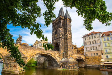 The Charles Bridge over the River Vltava connects the castle and the city of Prague and is lined with Statues