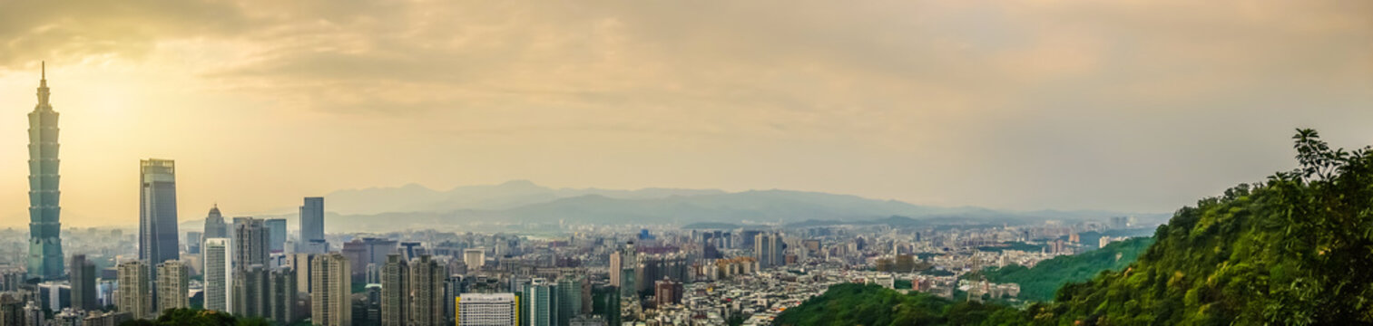 Panoramic of beautiful landscape and cityscape of taipei 101 building and architecture in the city skyline at sunset time in Taiwan