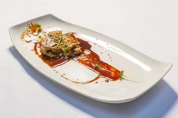 Crispy pork shoulder served with creamy mashed potatoes, demi-glace and coleslaw salad