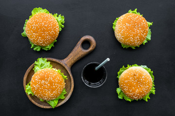 National american food concept with burgers and drink on black background top view