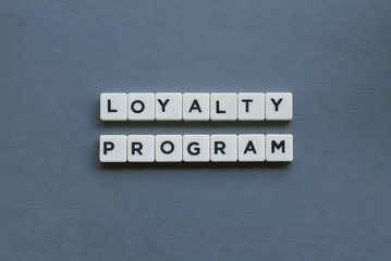 ' Loyalty Program ' word made of square letter word on grey background.