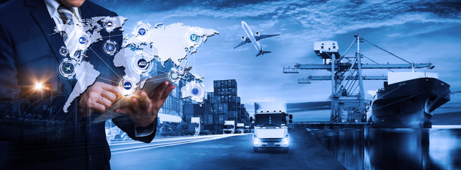Multiple exposures of Businessman touching tablet for analyze stock at logistics port and world map...