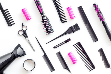 Hairdresser equipment for cutting hair and styling with combs, sciccors, brushes on white background top view pattern