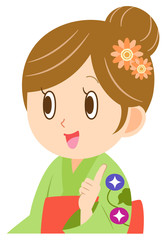 浴衣を着て指差しする女性