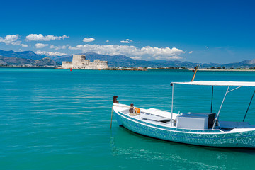 A fortress and boat in the harbor of Nafplion