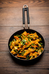 Mix vegetable curry - Indian main course recipe contains Carrots, cauliflower, green peas and beans, baby corn, capsicum and paneer/cottage cheese with traditional masala and curry, selective focus