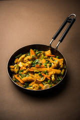 Mix vegetable curry - Indian main course recipe contains Carrots, cauliflower, green peas and beans, baby corn, capsicum and paneer/cottage cheese with traditional masala and curry, selective focus