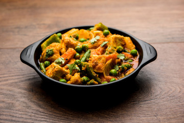 Mix vegetable curry - Indian main course recipe contains Carrots, cauliflower, green peas and beans, baby corn, capsicum and paneer/cottage cheese with traditional masala and curry, selective focus