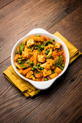 Mix vegetable curry - Indian main course recipe contains Carrots, cauliflower, green peas and beans, baby corn, capsicum and paneer/cottage cheese with traditional masala and curry, selective focus