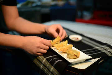 Chef decorating dish, chines deep fried dumpling
