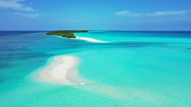Majestic Aerial View of a White sand Beach on a Motu Island in Rangiroa Atoll with sand banks , French Polynesia