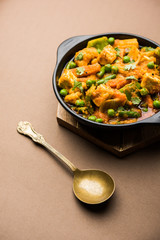 Mix vegetable curry - Indian main course recipe contains Carrots, cauliflower, green peas and beans, baby corn, capsicum and paneer/cottage cheese with traditional masala and curry, selective focus